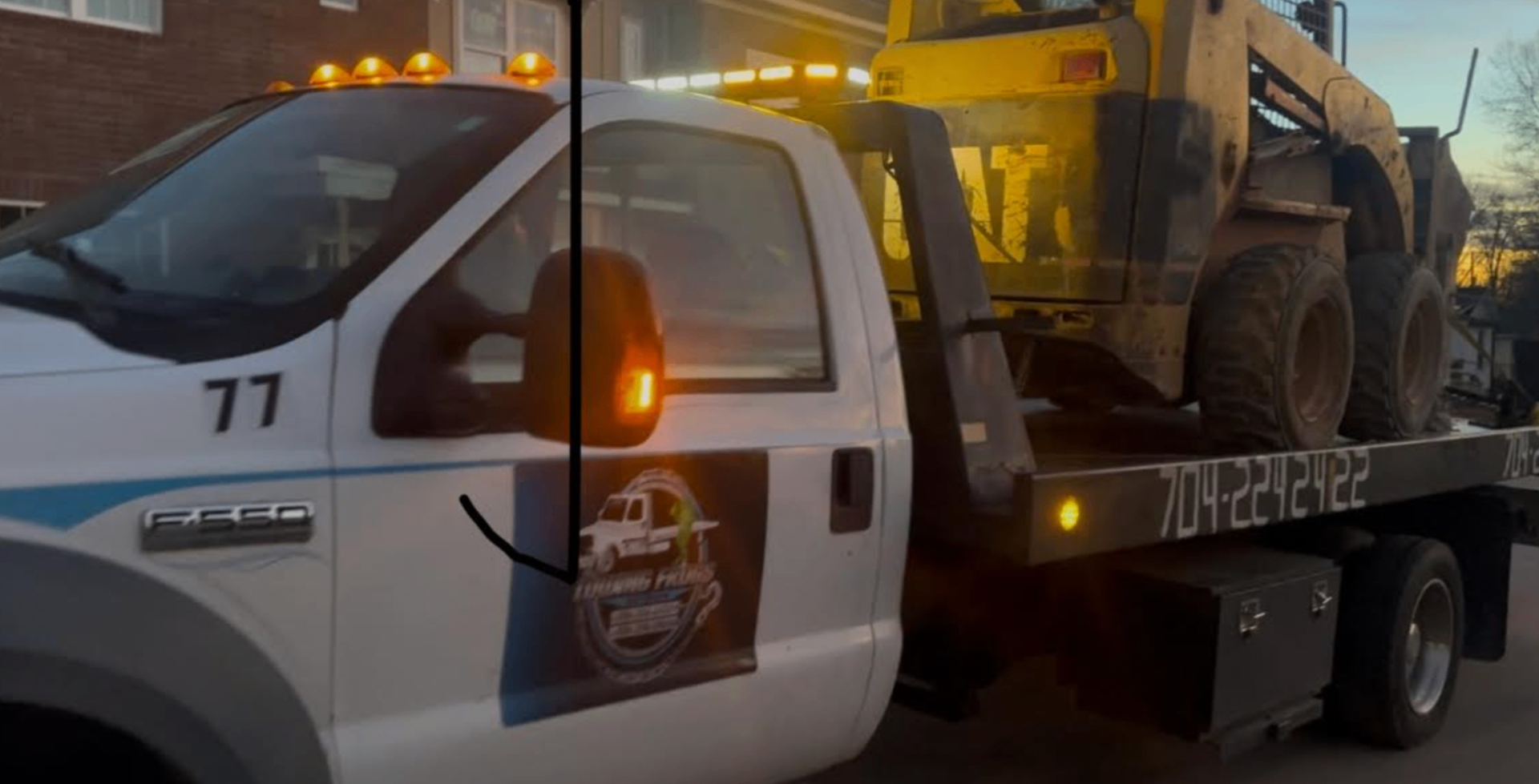 Towing Frogs F-550 flatbed hauling a skid steer